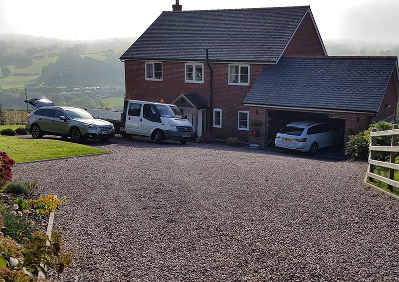 Sloping gravel driveway solution project in Derwen, North Wales