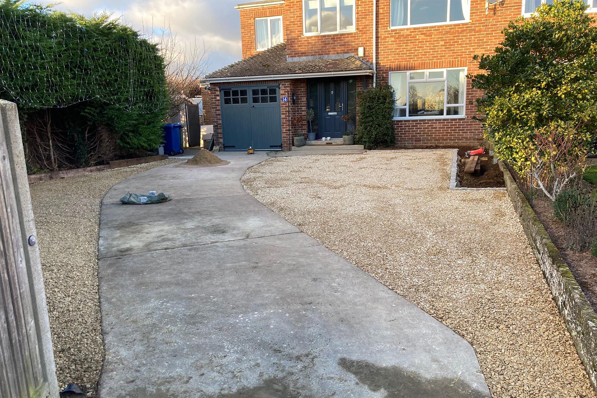 A hybrid gravel concrete driveway